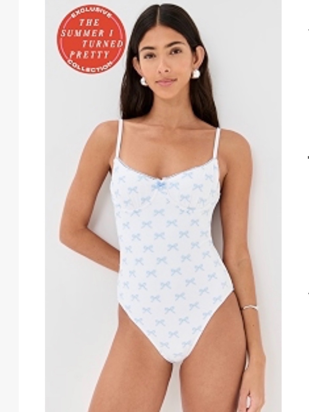 SOLID & STRIPED White One-Piece Swimsuit with Light Blue Bow embroidery.